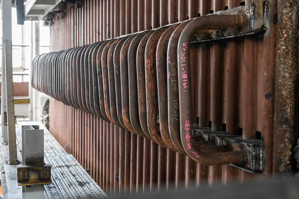 Economizer coil bank installed in a boiler second pass