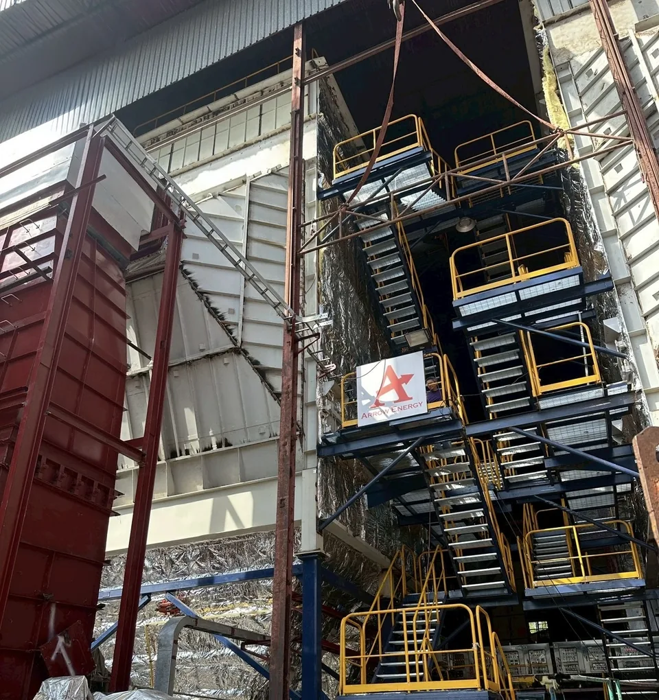 ESP casing, hopper and access stair tower during erection at an Arrow Energy site