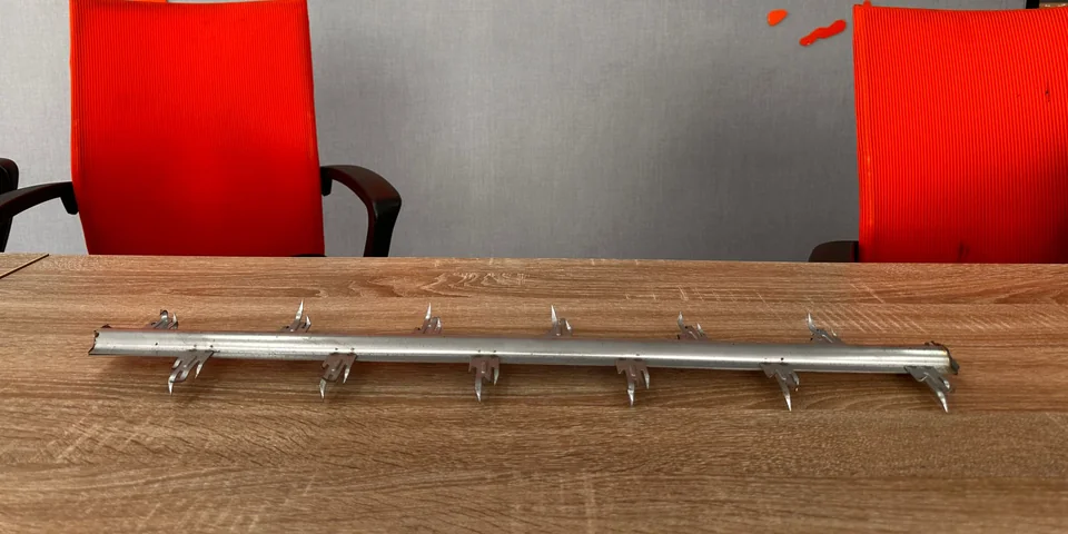Arrow Energy rigid-frame discharge electrode section: formed steel mast with multi-point spike emitter clusters at fixed pitch